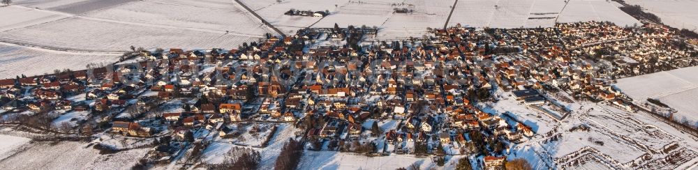 Rohrbach from above - Panorama perspecitve of Wintry snowy Village - view on the edge of agricultural fields and farmland in Rohrbach in the state Rhineland-Palatinate, Germany