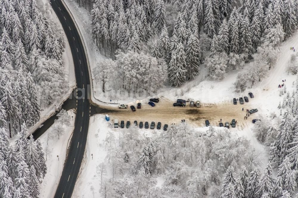 Aerial image Winterberg - Wintry snowy parking and storage space for automobiles on Astenweg in Winterberg at Sauerland in the state North Rhine-Westphalia, Germany