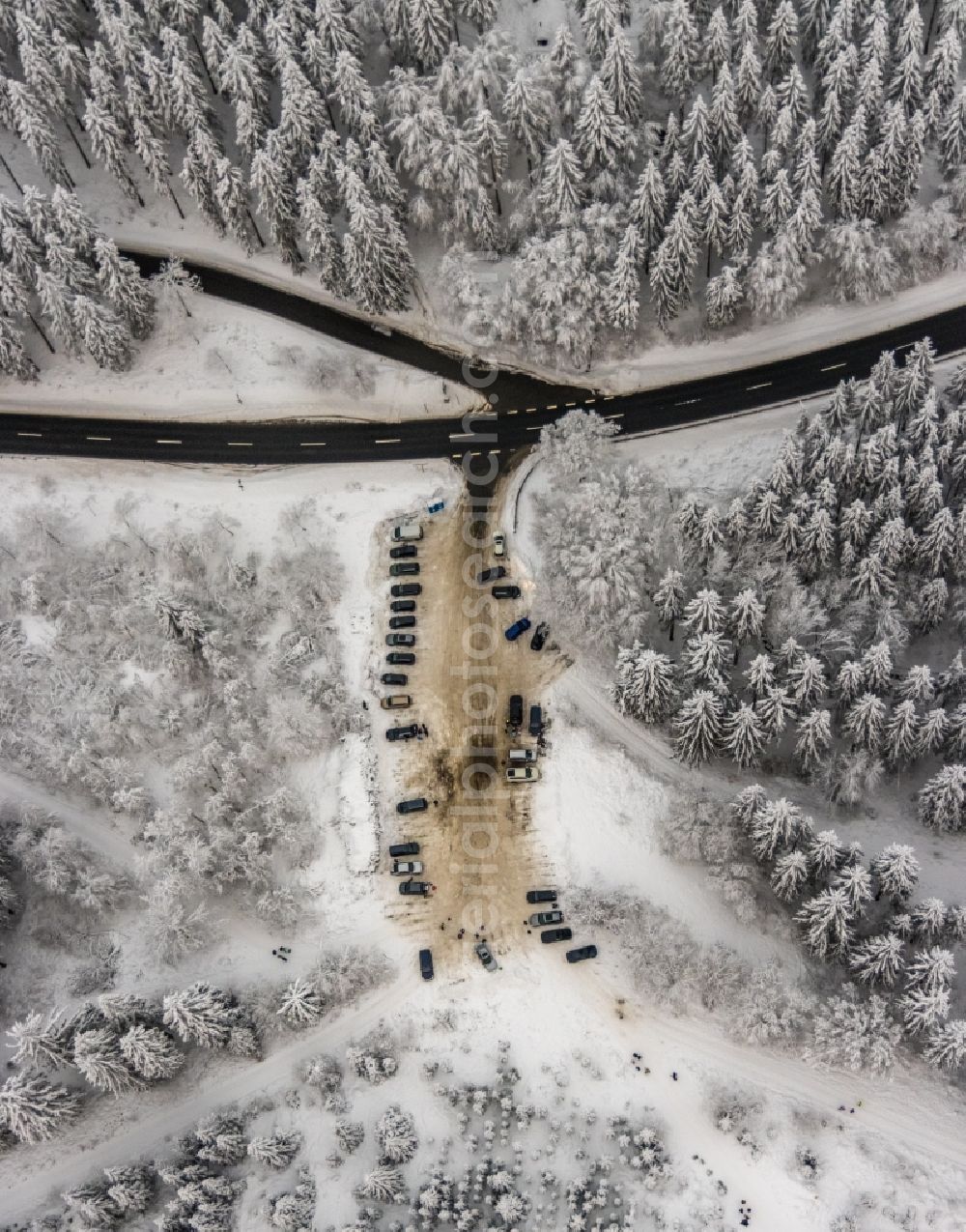 Aerial photograph Winterberg - Wintry snowy parking and storage space for automobiles on Astenweg in Winterberg at Sauerland in the state North Rhine-Westphalia, Germany