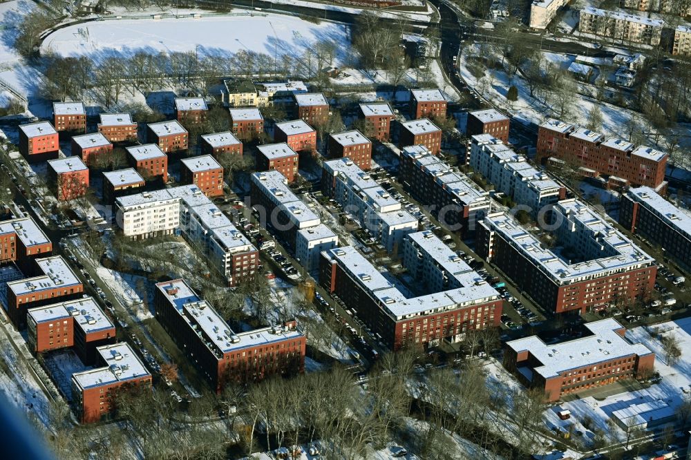 Berlin from above - Wintry snowy skyscrapers in the residential area of industrially manufactured settlement Gruetzmacherweg - Elsa-Wagner-Strasse - in the district Haselhorst in Berlin, Germany