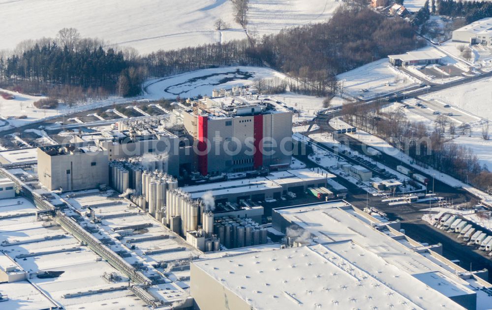 Aerial image Feldschlößchen - Wintry snowy production facilities of the Sachsenmilch company in Leppersdorf in the federal state of Saxony