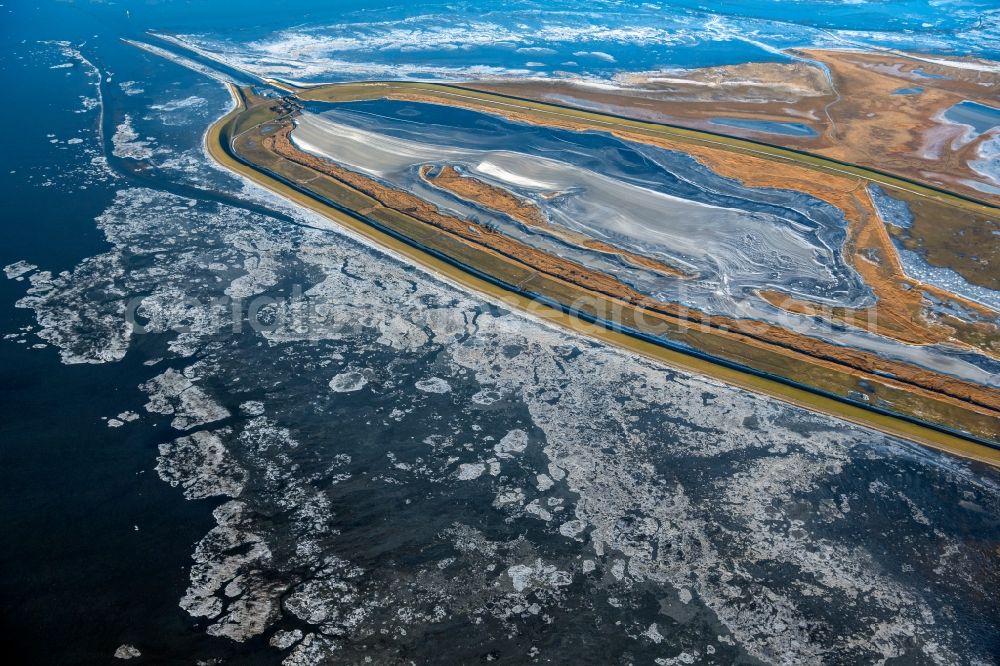 Aerial photograph Krummhörn - Wintry snowy retention basin and water storage Leyhoern in Krummhoern in the state Lower Saxony, Germany