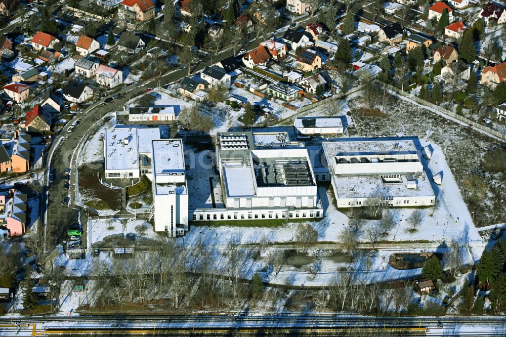 Aerial image Berlin - Wintry snowy Data center building and online data processing hub on street Florastrasse in the district Mahlsdorf in Berlin, Germany