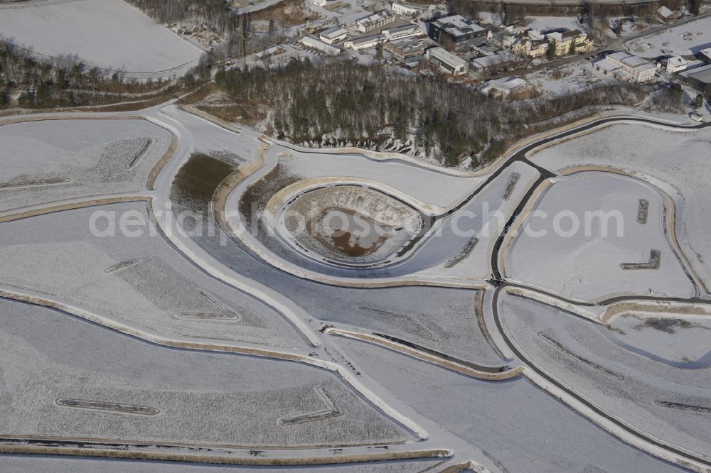 Wackersdorf from above - Wintry snowy rehabilitation and renaturation work on the layers of a mining waste dump in Wackersdorf in the state Bavaria, Germany