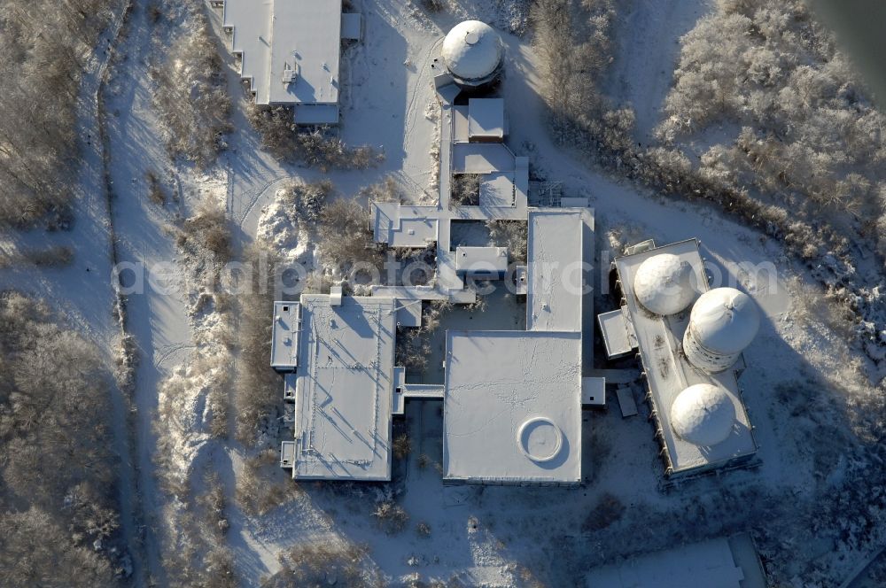 Aerial image Berlin - Wintry snowy ruins of the former American military interception and radar system on the Teufelsberg in Berlin - Charlottenburg