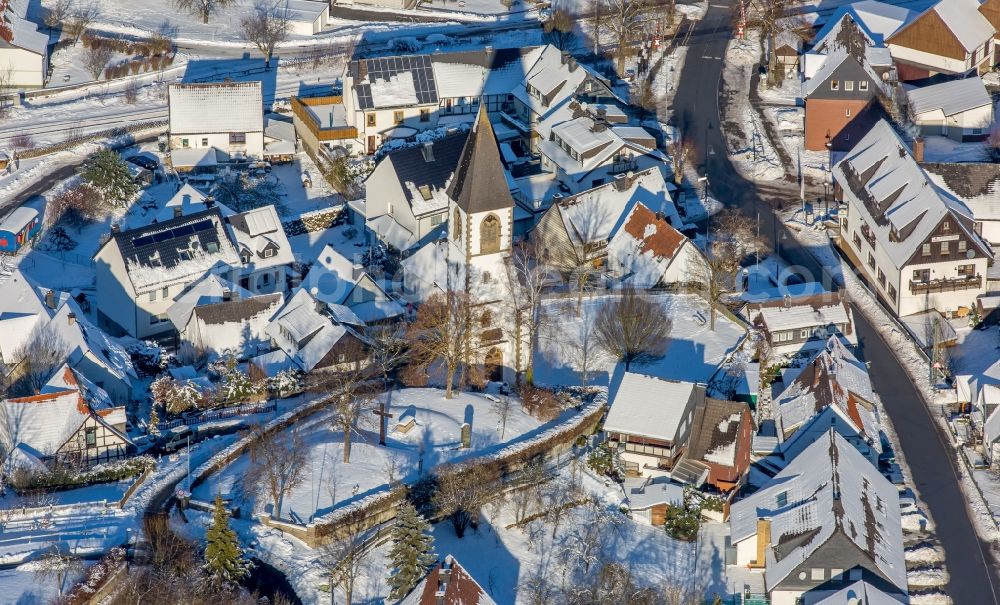 Aerial photograph Brilon - Wintry snowy ruins of church building Kirchturm- Reste am Kirchberg in the district Messinghausen in Brilon in the state North Rhine-Westphalia