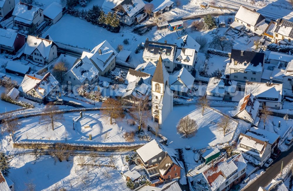 Brilon from the bird's eye view: Wintry snowy ruins of church building Kirchturm- Reste am Kirchberg in the district Messinghausen in Brilon in the state North Rhine-Westphalia