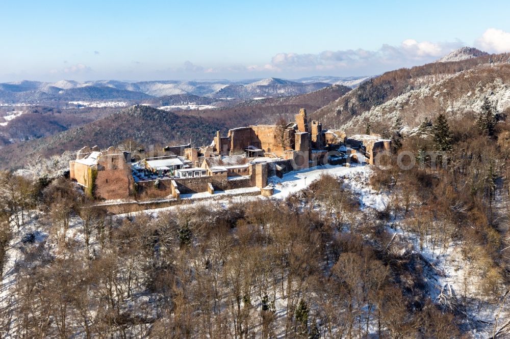 Eschbach from above - Wintry snowy ruins and vestiges of the former castle and fortress Burgruine Madenburg in Eschbach in the state Rhineland-Palatinate