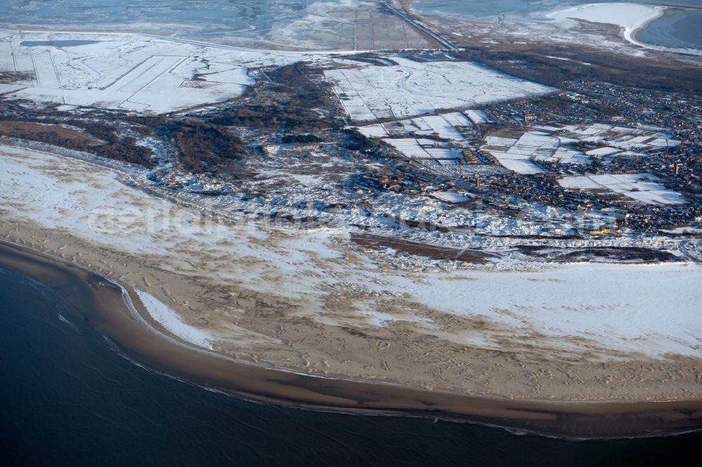 Borkum from the bird's eye view: Wintry snowy nothern sandy coastline on the North Sea Island Borkum in the state Lower Saxony