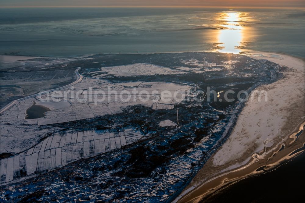 Borkum from above - Wintry snowy nothern sandy coastline on the North Sea Island Borkum in the state Lower Saxony