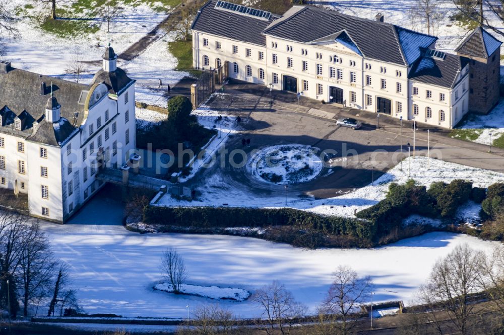 Essen from above - Wintry snowy building complex in the park of the castle on street Schlossstrasse in the district Borbeck in Essen at Ruhrgebiet in the state North Rhine-Westphalia, Germany