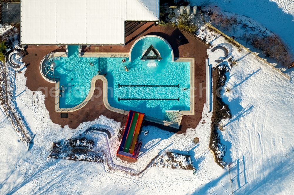 Warstein from above - Wintry snowy swimming pool of the Allwetterbad Warstein on Lortzingstrasse in Warstein in the state North Rhine-Westphalia