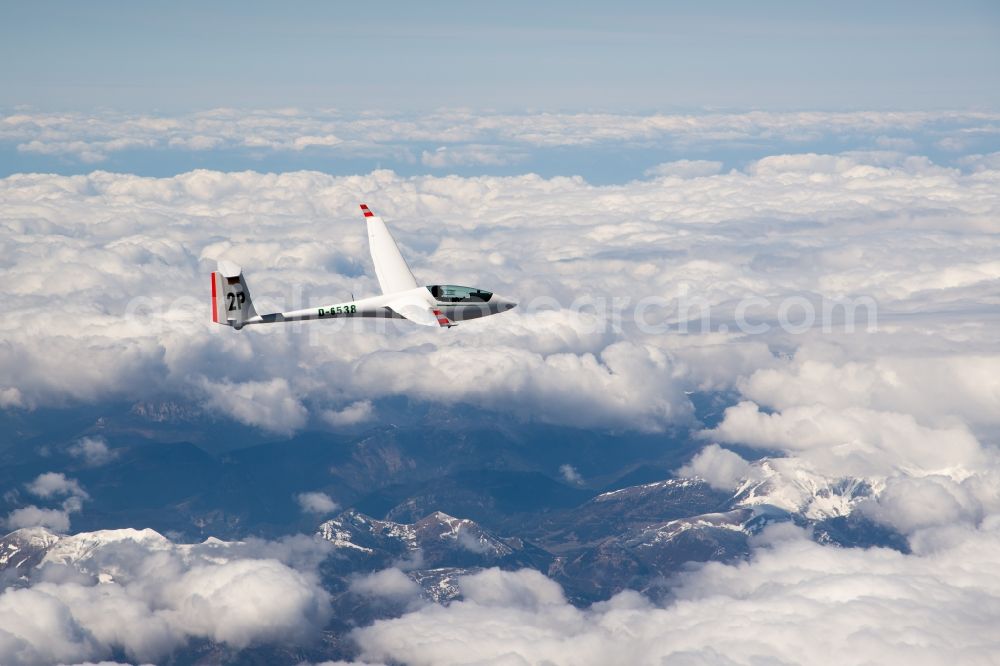 La Chapelle-en-Valgaudémar from above - Wintry snowy The ASW 20 D-6538 glider flying above the snow-capped mountains of the Ecrins National Park near La Chapelle-en-Valgaudemar in Provence-Alpes-Cote d'Azur, France