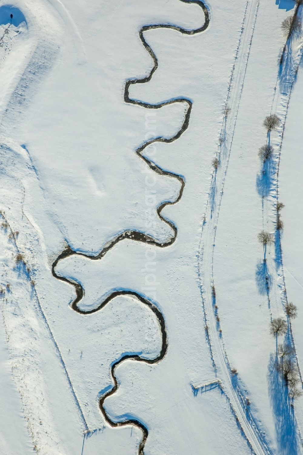 Brilon from the bird's eye view: Wintry snowy mean dering, serpentine curve of a river Moehne in Brilon in the state North Rhine-Westphalia