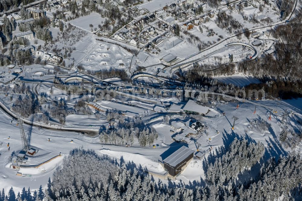 Winterberg from above - Wintry snowy serpentine curve of the racetrack route of Bobbahn Winterberg Hochsauerland in Winterberg in the state North Rhine-Westphalia