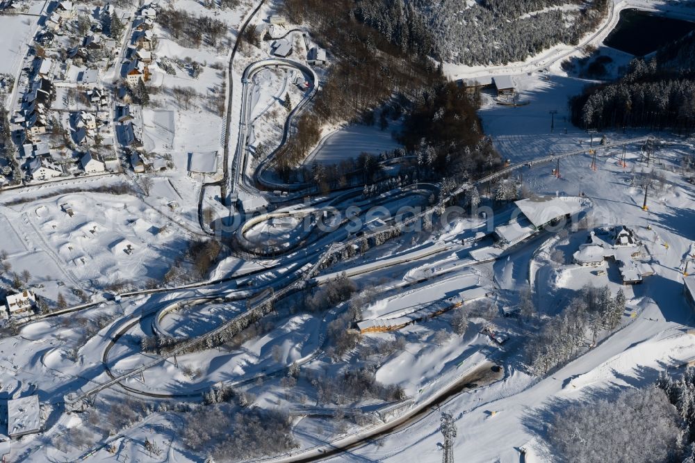 Winterberg from above - Wintry snowy serpentine curve of the racetrack route of Bobbahn Winterberg Hochsauerland in Winterberg in the state North Rhine-Westphalia