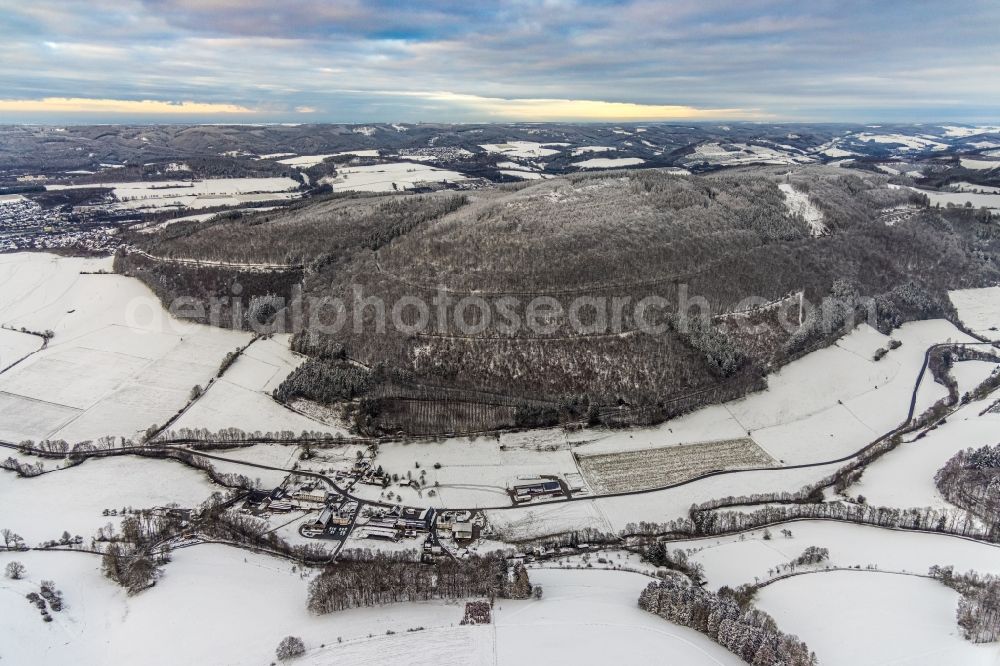 Aerial image Heggen - Wintry snowy the district Heggen with Berg Vogelsang in Meschede at Sauerland in the state North Rhine-Westphalia, Germany