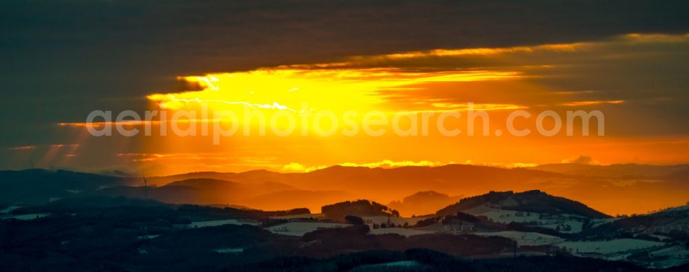 Winterberg from the bird's eye view: Wintry snowy sunset over the countryside on Rothaargebirge in Winterberg in the state North Rhine-Westphalia, Germany