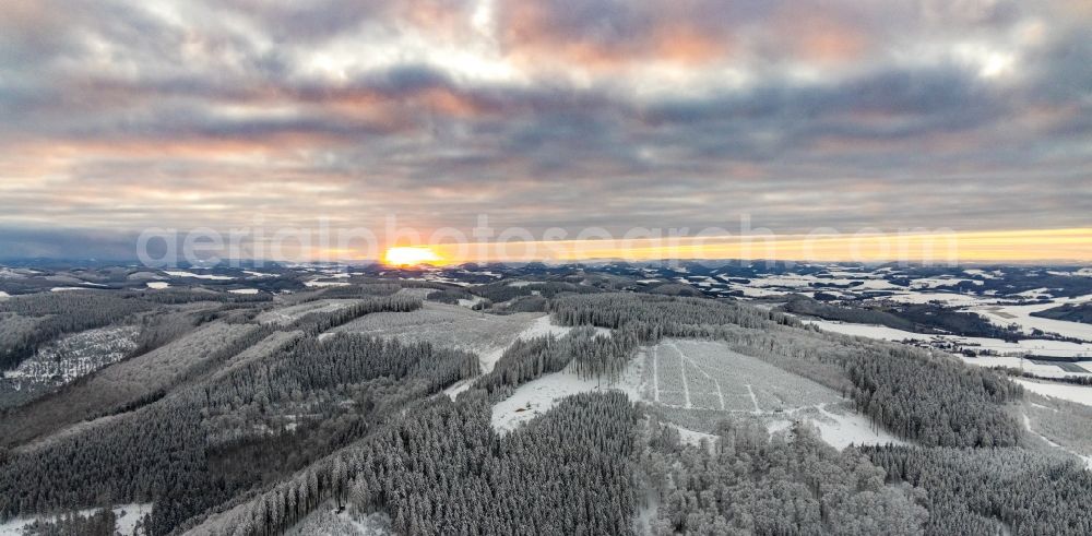 Aerial image Winterberg - Wintry snowy sunset over the countryside on Rothaargebirge in Winterberg in the state North Rhine-Westphalia, Germany