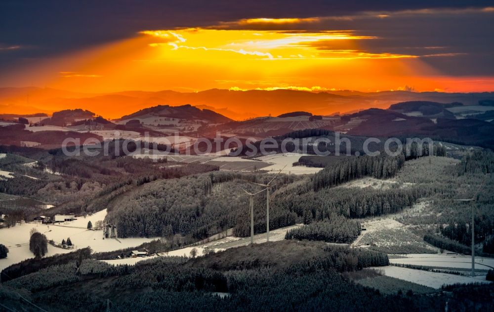 Winterberg from the bird's eye view: Wintry snowy sunset over the countryside on Rothaargebirge in Winterberg in the state North Rhine-Westphalia, Germany