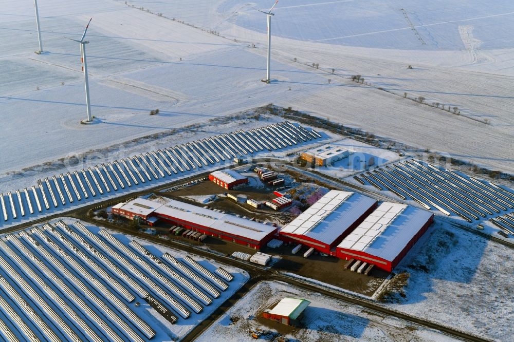 Lübesse from above - Wintry snowy freight forwarding building a logistics and transport company Transporte & Logistik Theurer on Gewerbering in Luebesse in the state Mecklenburg - Western Pomerania, Germany