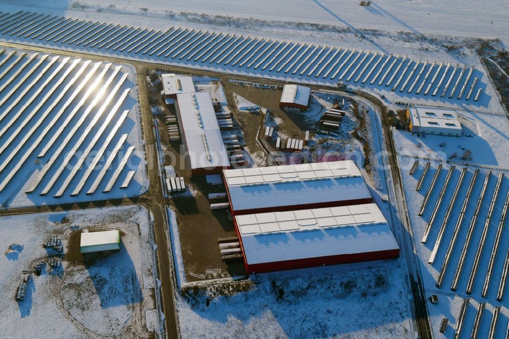 Lübesse from the bird's eye view: Wintry snowy freight forwarding building a logistics and transport company Transporte & Logistik Theurer on Gewerbering in Luebesse in the state Mecklenburg - Western Pomerania, Germany