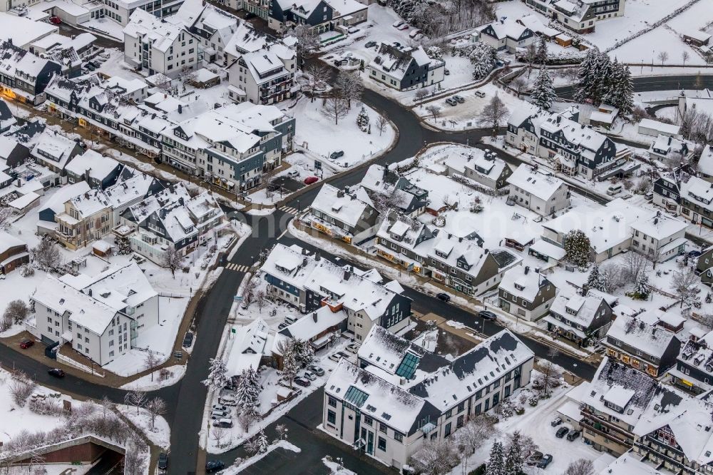 Winterberg from above - Wintry snowy city view on down town along the Strasse Im Hohlen Seifen in Winterberg at Sauerland in the state North Rhine-Westphalia, Germany