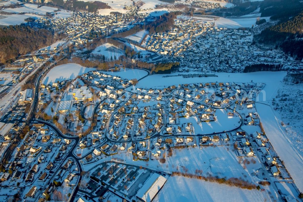 Aerial photograph Bestwig - Wintry snowy city area of in the district Ramsbeck in Bestwig in the state North Rhine-Westphalia