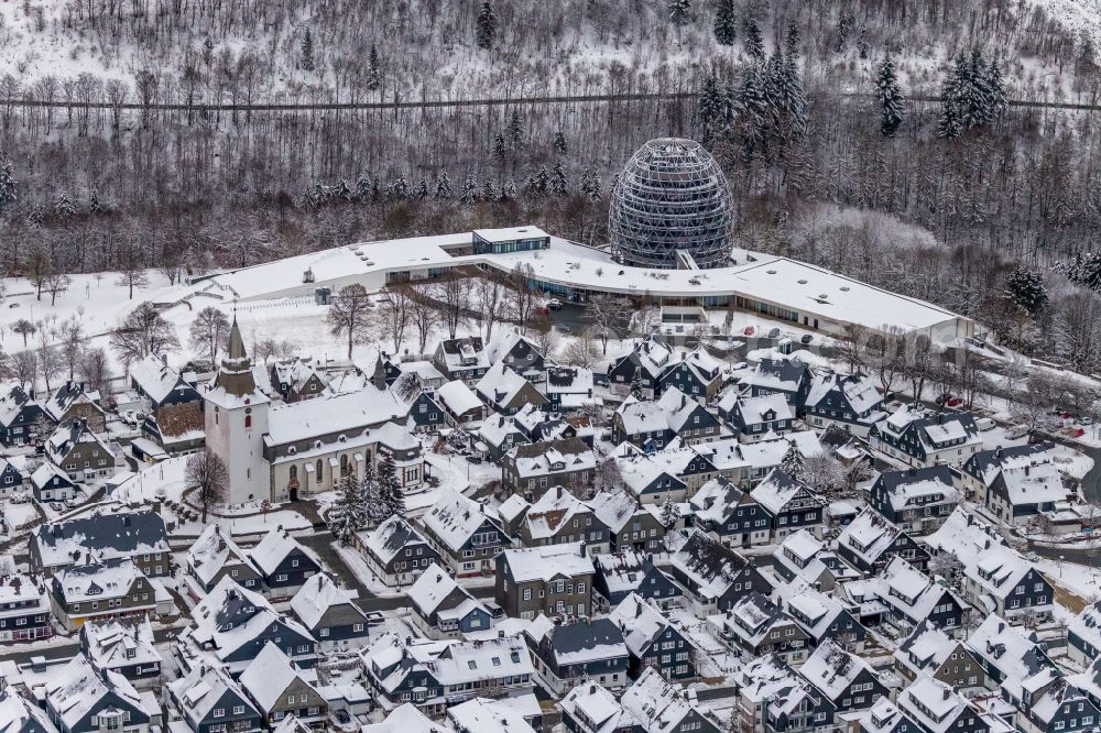 Aerial photograph Winterberg - Wintry snowy city view on down town in Winterberg at Sauerland in the state North Rhine-Westphalia, Germany