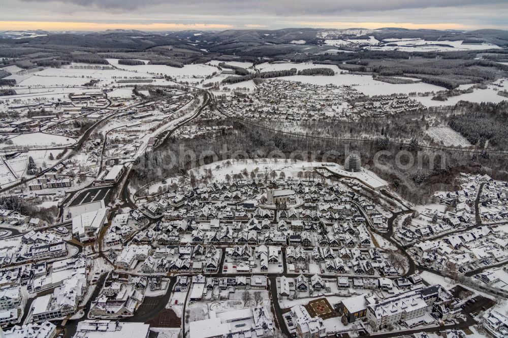 Winterberg from the bird's eye view: Wintry snowy city view on down town in Winterberg at Sauerland in the state North Rhine-Westphalia, Germany