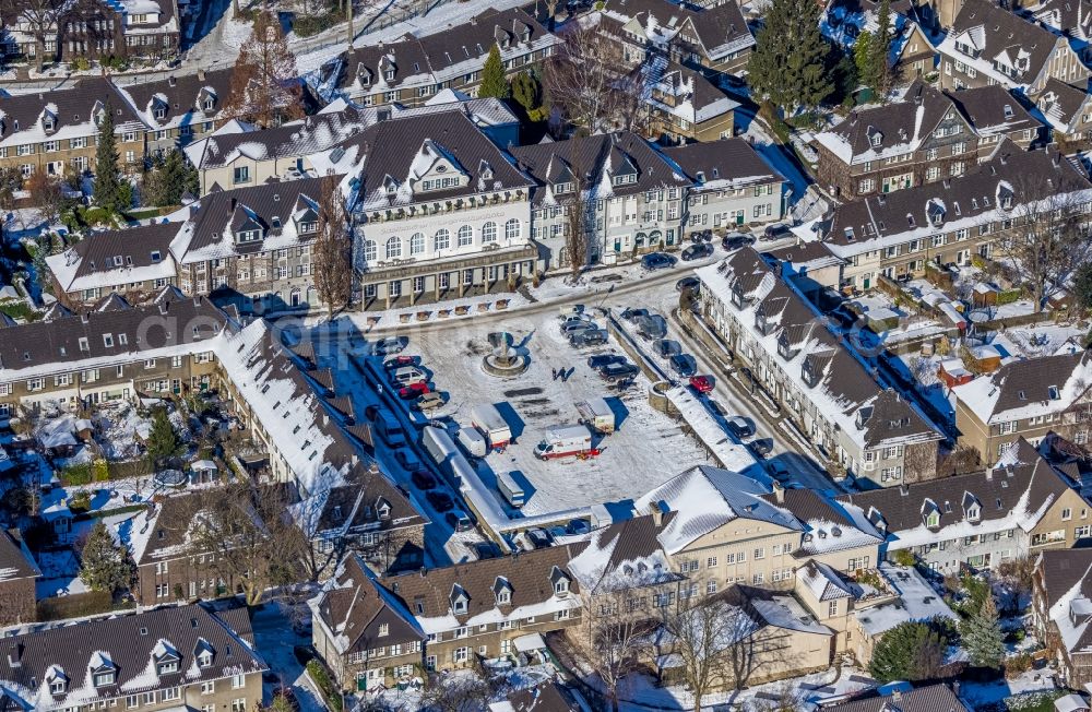 Aerial photograph Essen - Wintry snowy city view around the small market in the Margarethehoehe district of Essen at Ruhrgebiet in the state of North Rhine-Westphalia