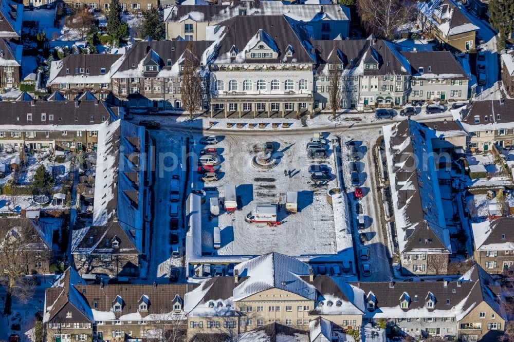 Essen from above - Wintry snowy city view around the small market in the Margarethehoehe district of Essen at Ruhrgebiet in the state of North Rhine-Westphalia