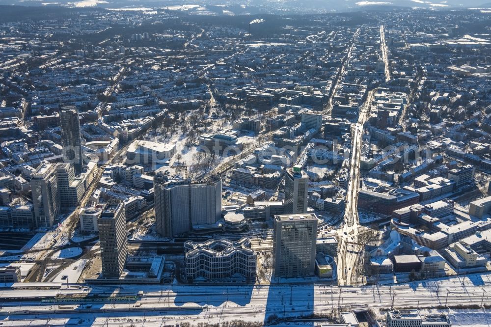 Essen from the bird's eye view: Wintry snowy cityscape of the district Suedviertel along Bismarckstrasse in the district Suedviertel in Essen at Ruhrgebiet in the state North Rhine-Westphalia, Germany