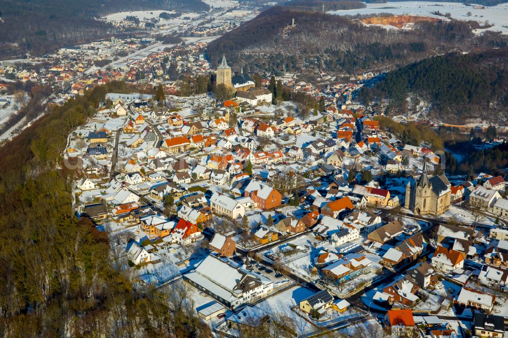 Marsberg from above - Wintry snowy urban area with outskirts and inner city area on the edge of agricultural fields and arable land in Marsberg at Sauerland in the state North Rhine-Westphalia, Germany