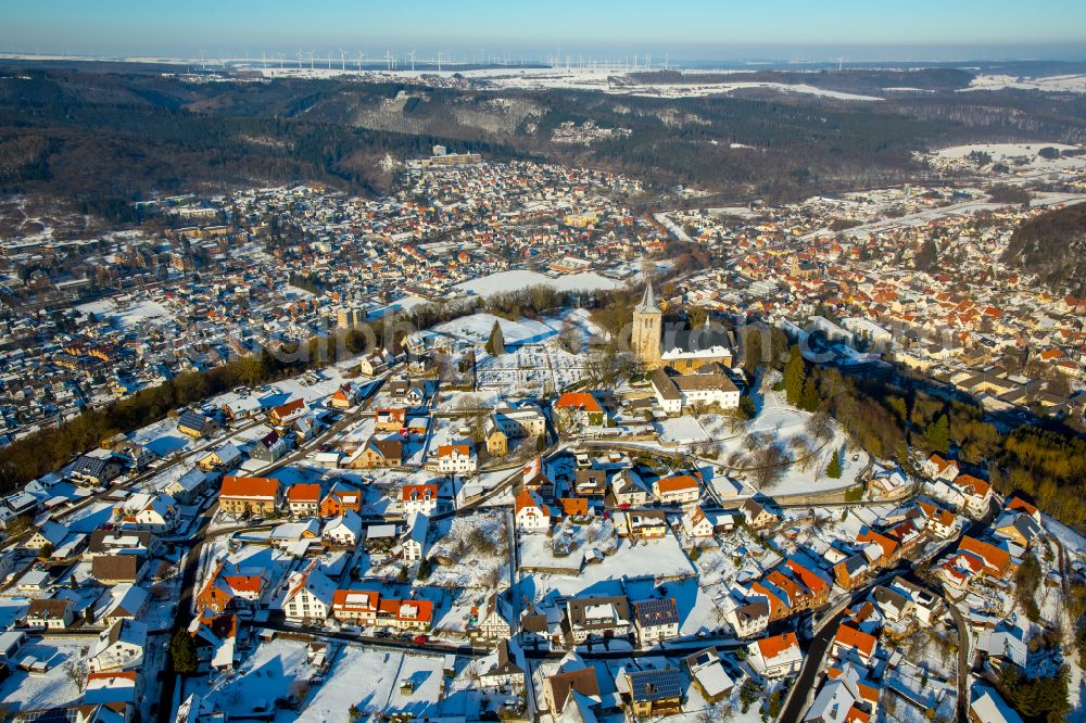 Marsberg from above - Wintry snowy urban area with outskirts and inner city area on the edge of agricultural fields and arable land in Marsberg at Sauerland in the state North Rhine-Westphalia, Germany