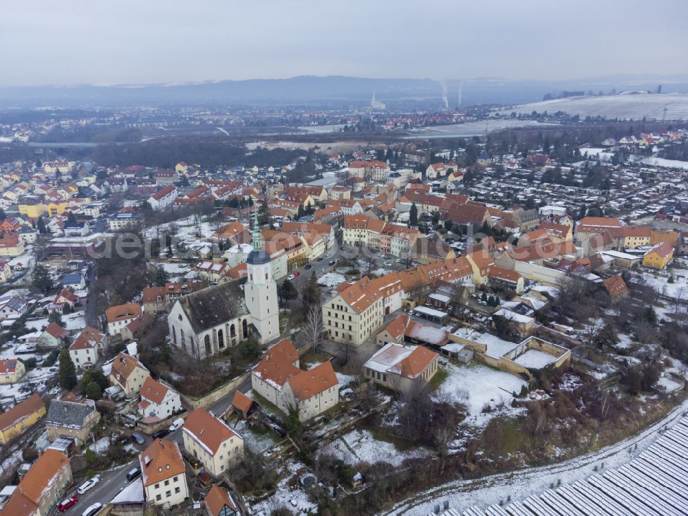 Dohna from the bird's eye view: Wintry snowy the city center in the downtown area in Dohna in the state Saxony, Germany