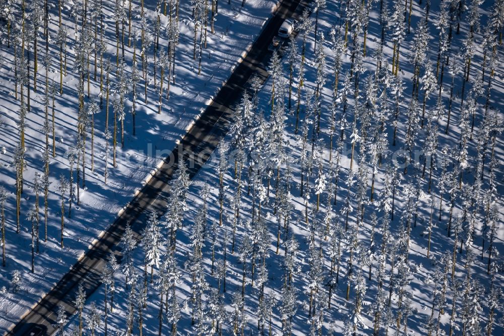 Altlastenberg from the bird's eye view: Wintry snowy street - road guidance of Hochsauerland Hoehenstrasse in Altastenberg at Sauerland in the state North Rhine-Westphalia, Germany