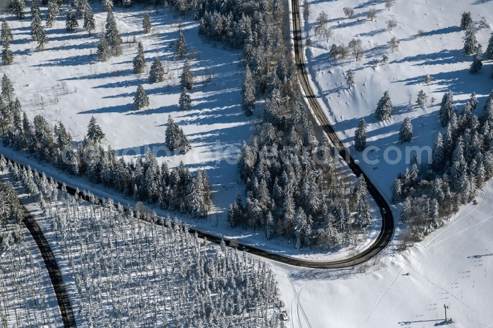 Altastenberg from above - Winter aerial view of the course of the road layout of the country road L540 in Altastenberg in the Sauerland in the state of North Rhine-Westphalia, Germany