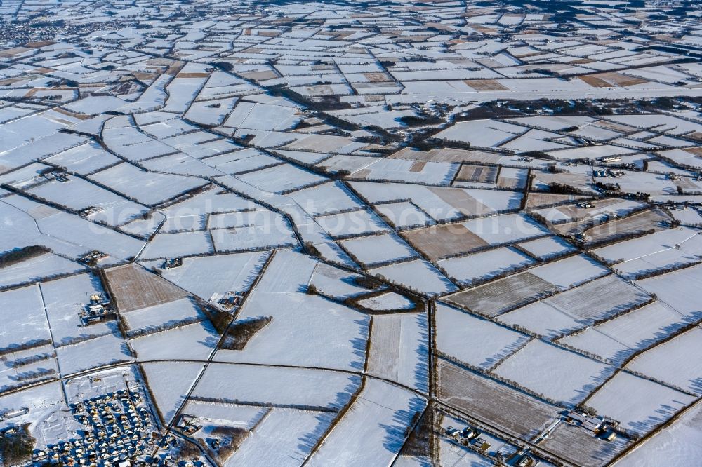 Bregenbeck from the bird's eye view: Wintry snowy structures on agricultural fields in Bregenbeck in the state Lower Saxony, Germany