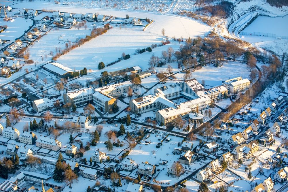 Aerial photograph Bestwig - Wintry snowy Student Residence - Building BERUFSKOLLEG Bergkloster Bestwig Zum Bergkloster in the district Ostwig in Bestwig in the state North Rhine-Westphalia