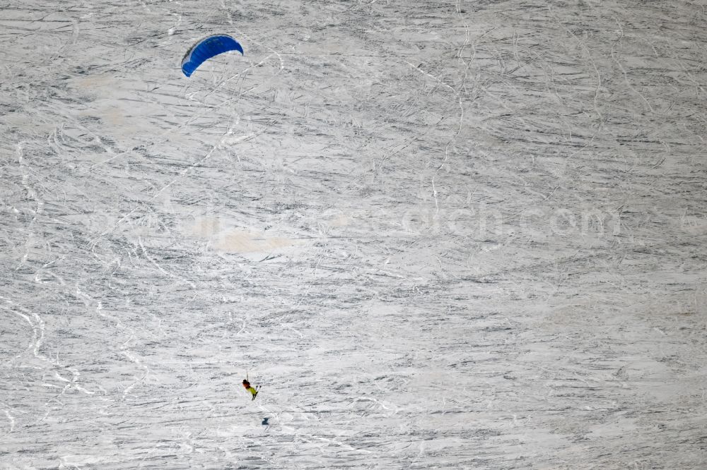 Aerial image Gersfeld (Rhön) - Winter aerial photo Surfer - Kitesurfer - Snowkiter in ride on the Wasserkuppe in Gersfeld (Rhoen) in the Rhoen in the state Hesse, Germany