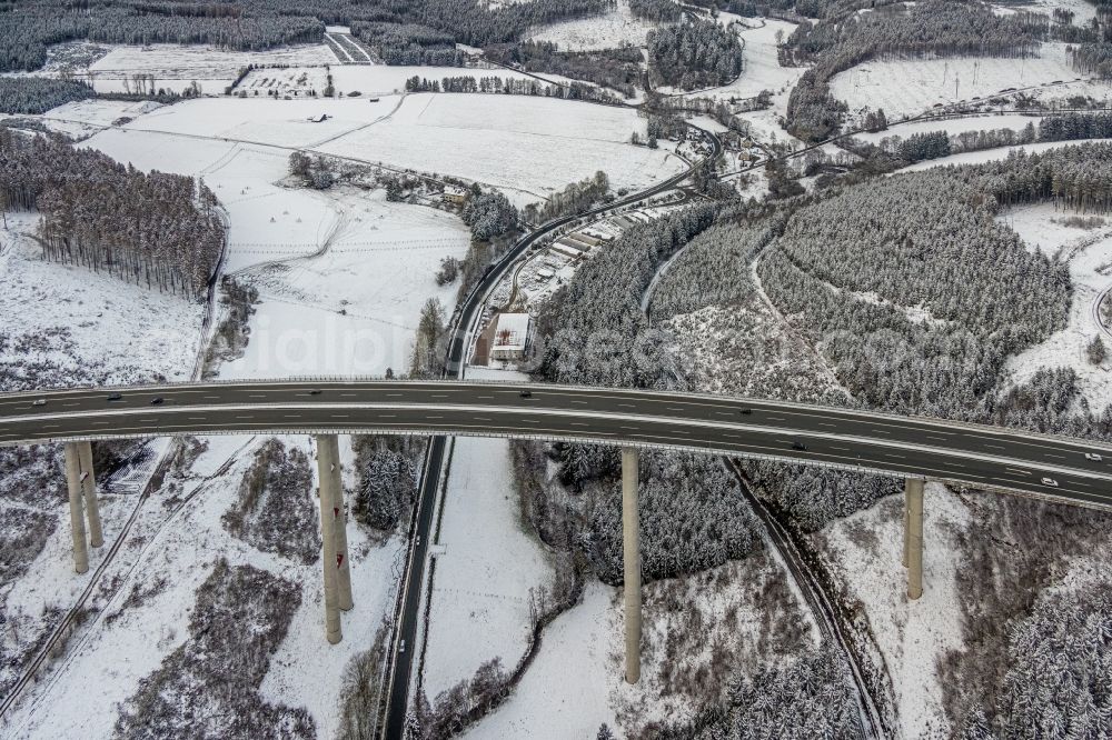 Nuttlar from the bird's eye view: Wintry snowy the Talbruecke Nuttlar of the federal motorway BAB 46 near Nuttlar is the highest bridge in North Rhine-Westphalia with a height of 115 meters