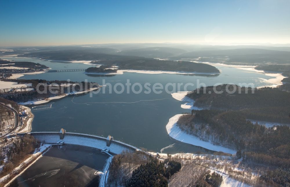 Möhnesee from above - Wintry snowy Dam and shore areas at the lake Moehnesee in the state North Rhine-Westphalia