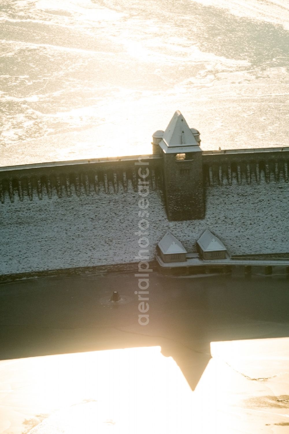 Möhnesee from above - Wintry snowy Dam and shore areas at the lake Moehnesee in the state North Rhine-Westphalia