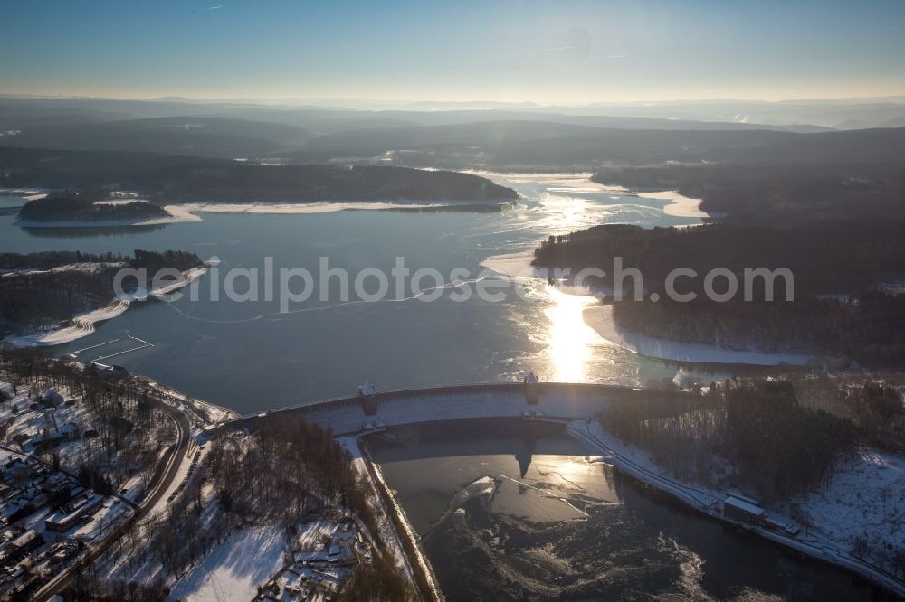 Möhnesee from above - Wintry snowy Dam and shore areas at the lake Moehnesee in the state North Rhine-Westphalia