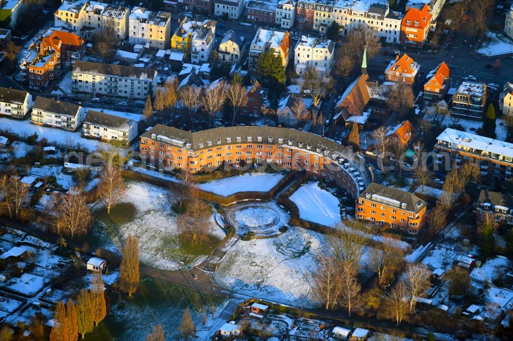 Lübeck from the bird's eye view: Wintry snowy tourist attraction and sightseeing Tor der Hoffnung on Rudolf-Groth-Strasse in Luebeck in the state Schleswig-Holstein, Germany