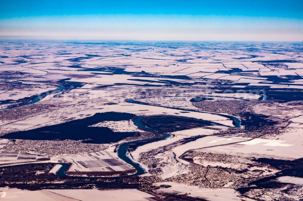 Aerial image Parata - Wintry snowy curved loop of the riparian zones on the course of the river Dnister in Parata in Criuleni District, Moldawien