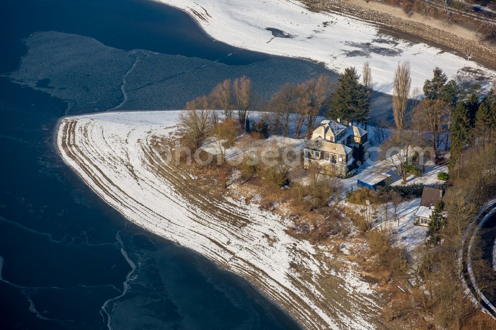 Delecke from above - Wintry snowy Riparian areas on the lake area of Moehnesee in Delecke in the state North Rhine-Westphalia