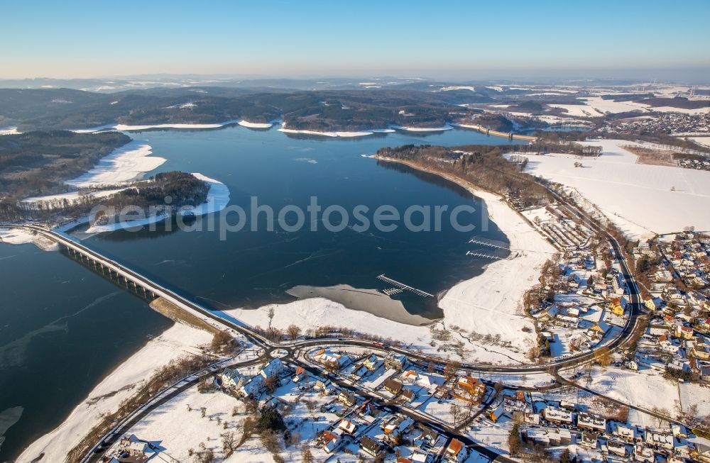 Delecke from above - Wintry snowy Riparian areas on the lake area of Moehnesee in Delecke in the state North Rhine-Westphalia