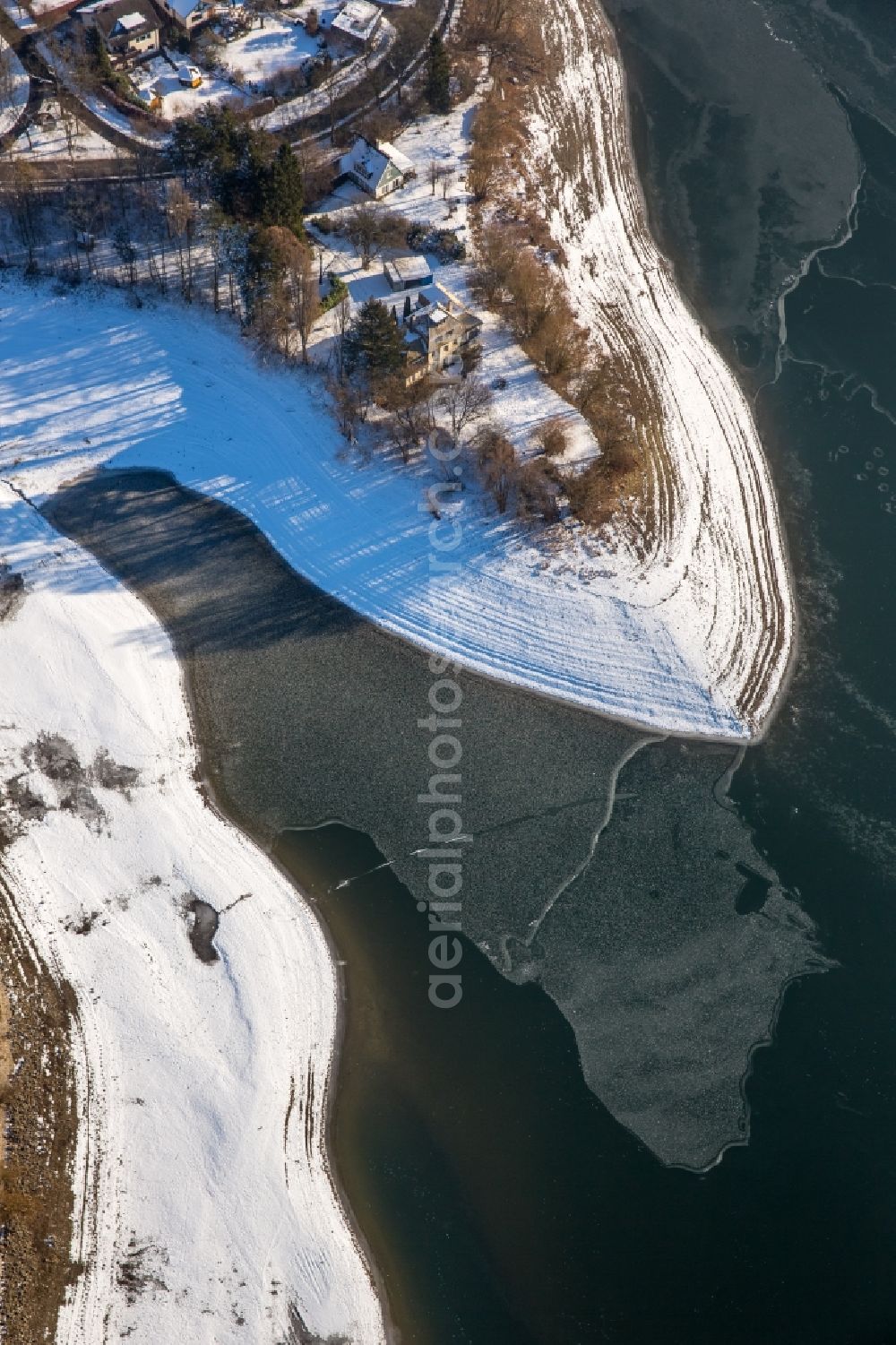 Delecke from above - Wintry snowy Riparian areas on the lake area of Moehnesee in Delecke in the state North Rhine-Westphalia